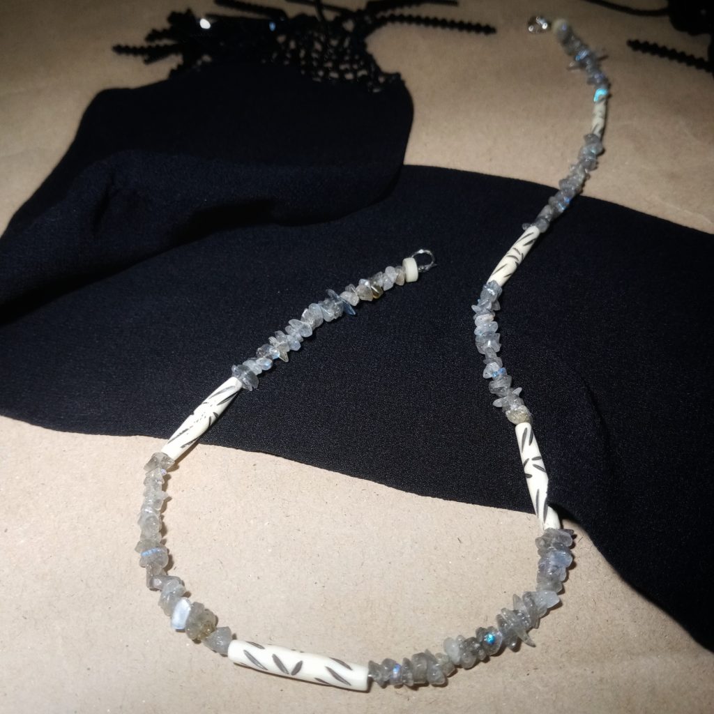 Beaded necklace combining moonstone and buffalo horn wearable art by Khumoetsile Seamogano