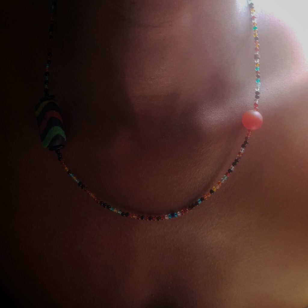 Beaded necklace made with tiny agate beads, carnelian and an antique Ghanaian bead wearable art by Khumoetsile Seamogano