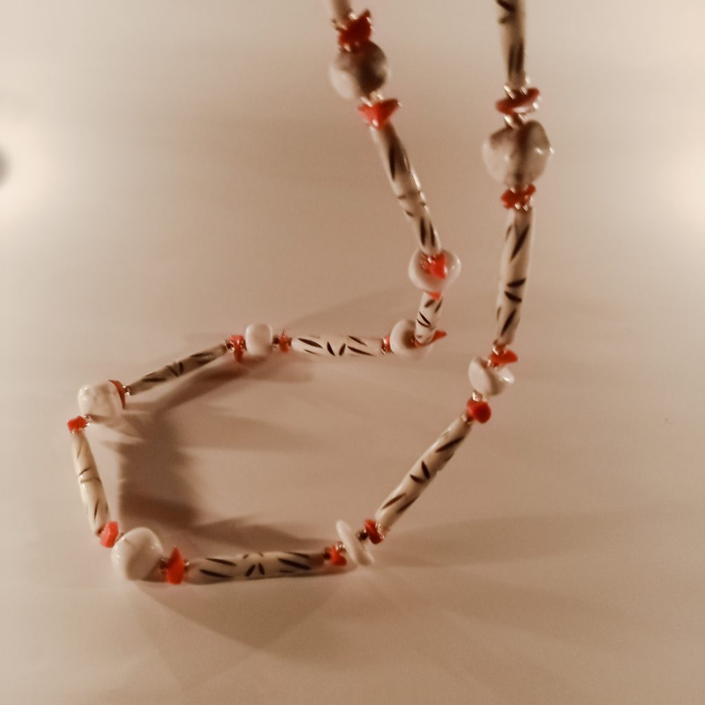 Sticks and Stones Beaded necklace made with buffalo horn, antique coral, howlite and Czech glass beads wearable art by Khumoetsile Seamogano