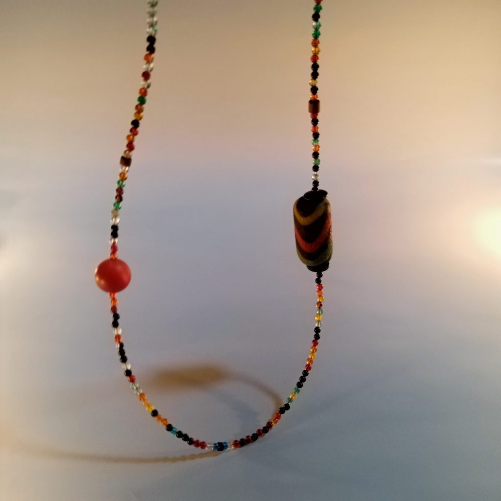 Beaded necklace made with tiny agate beads, carnelian and an antique Ghanaian bead